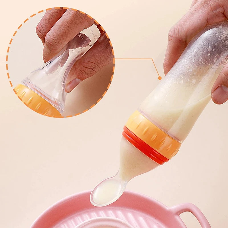 Soft-tip baby spoon feeder for mess-free feeding.